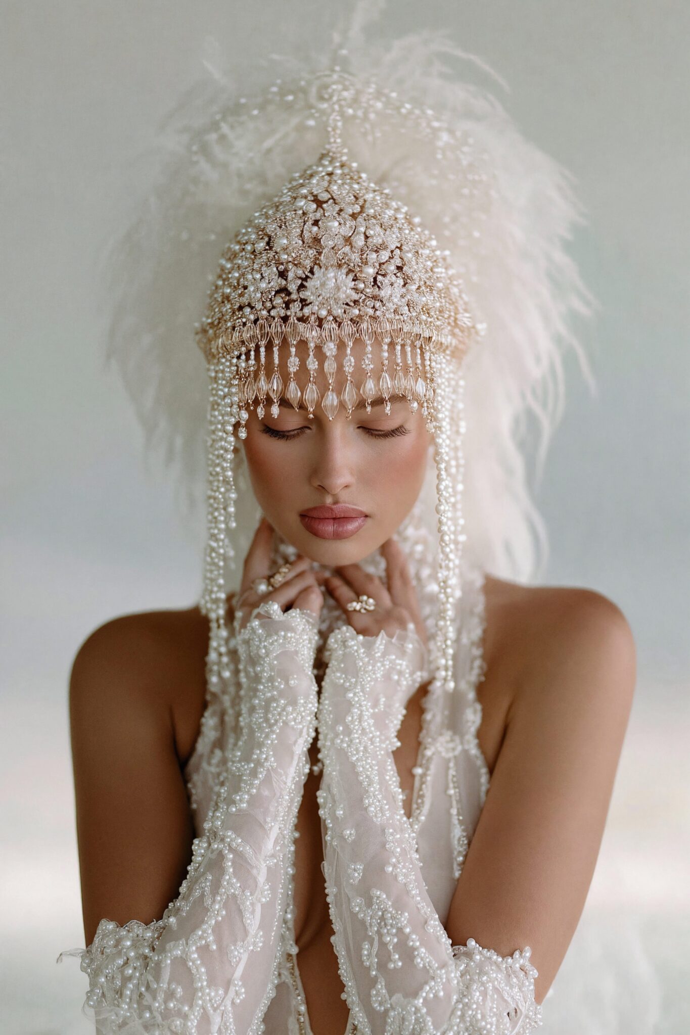 Close-up AI bridal portrait with pearl headdress and soft feather details, cinematic light, luxury tone
