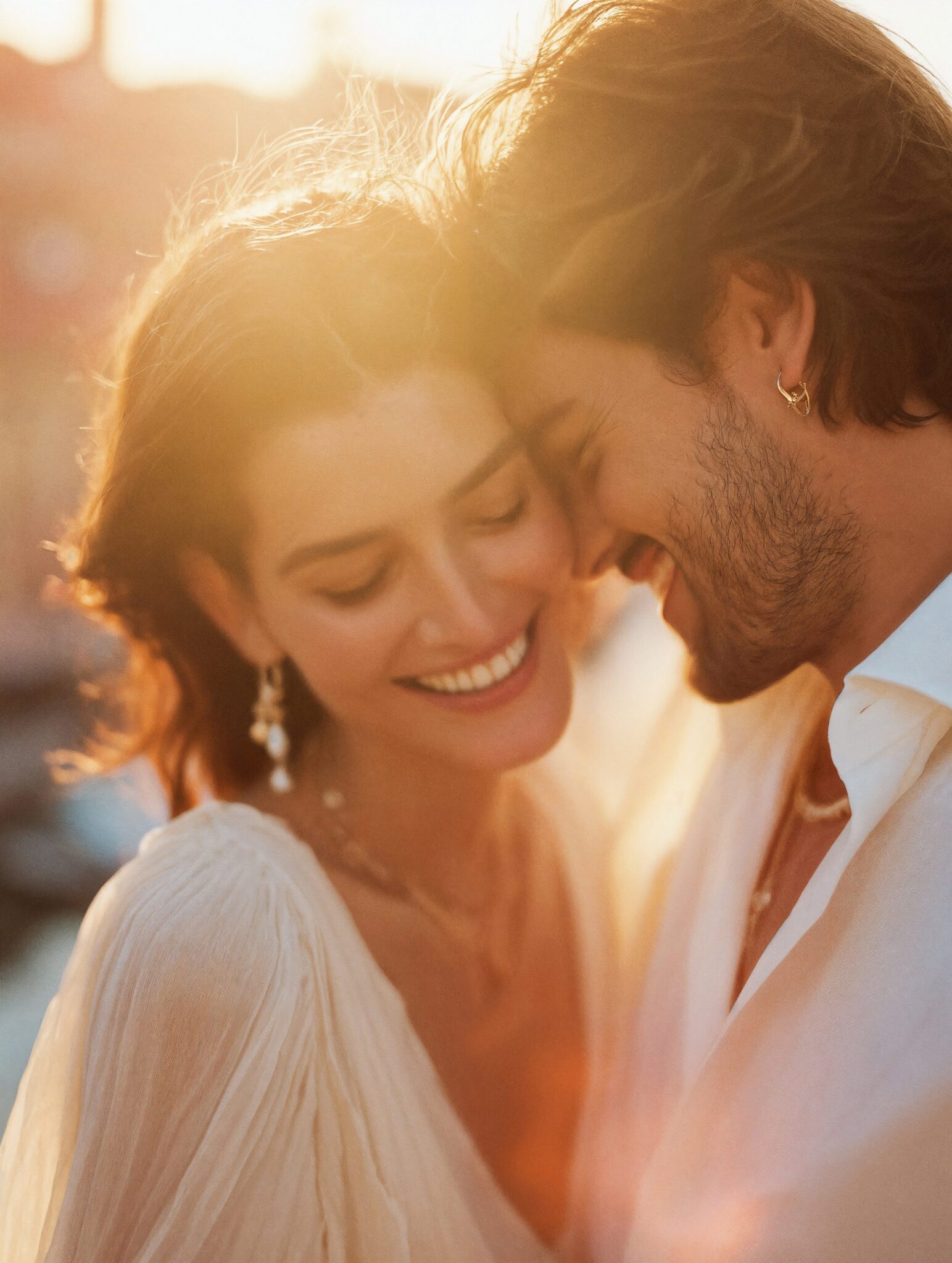 AI-generated couple smiling in golden hour light, warm editorial tone, cinematic bridal visual