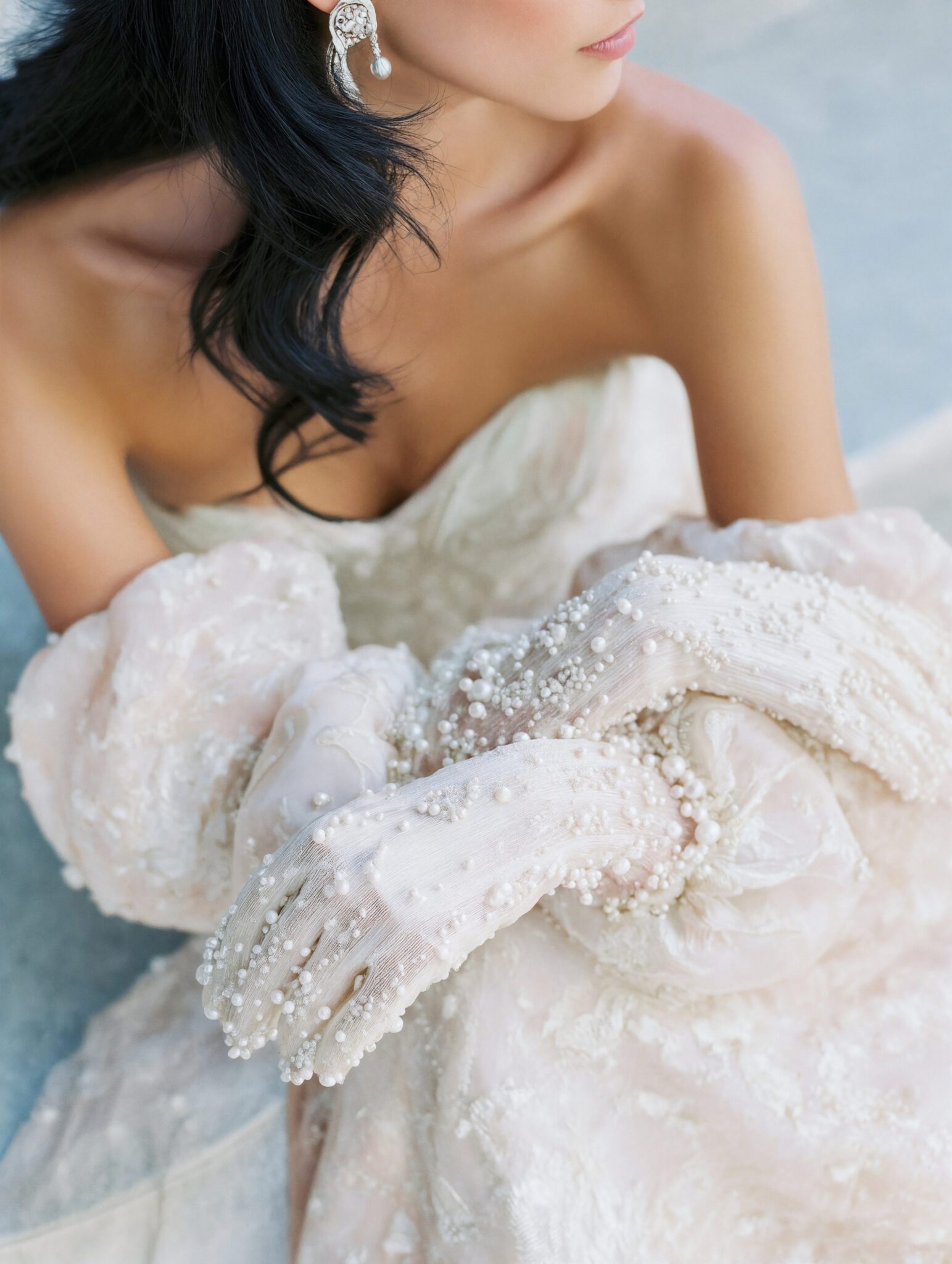Photoreal AI bridal model wearing pearl-embroidered gloves, couture gown, soft daylight, luxury editorial tone